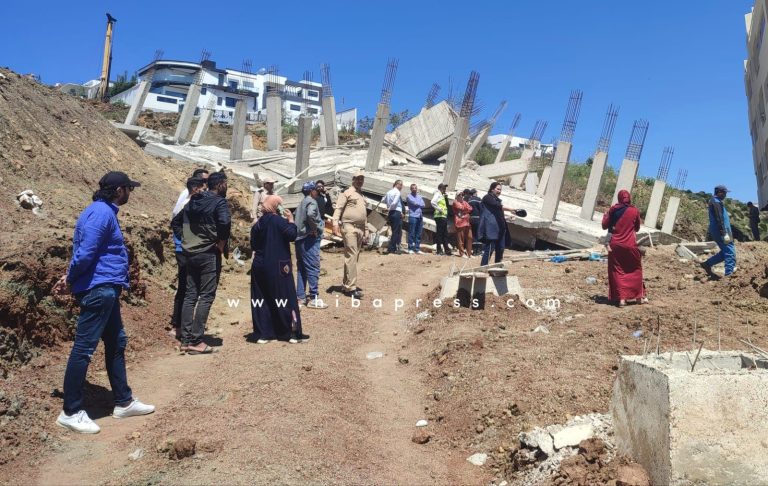 Collapse of building construction workshops in Tangier.  Efforts to recover alleged guard from under rubble continue