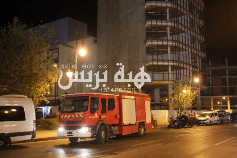 In pictures: A person threatens to commit suicide from the top of a building in Tangier
