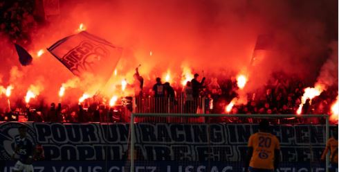 A French fan burns an Algerian flag in the stands during a French Ligue 1 match. Consequences