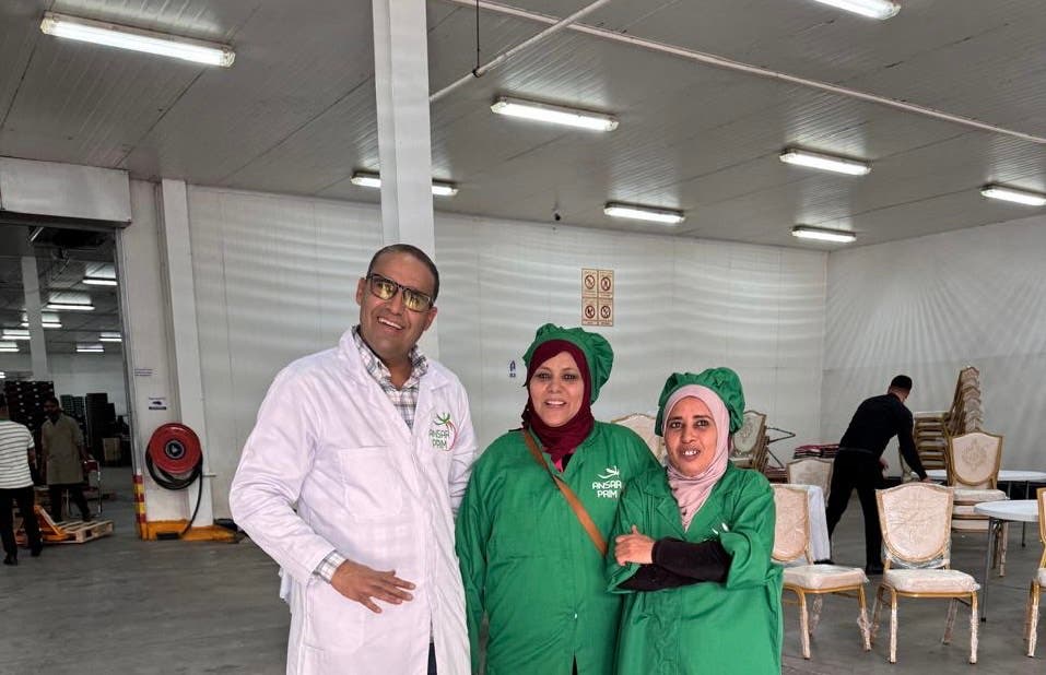 Workers of a fruit and vegetable export company celebrate Independence Day