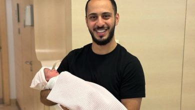 Al -Walid Miqdad lives with his first child and shares his joy with his disciples