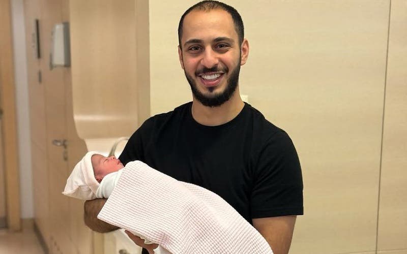 Al -Walid Miqdad lives with his first child and shares his joy with his disciples