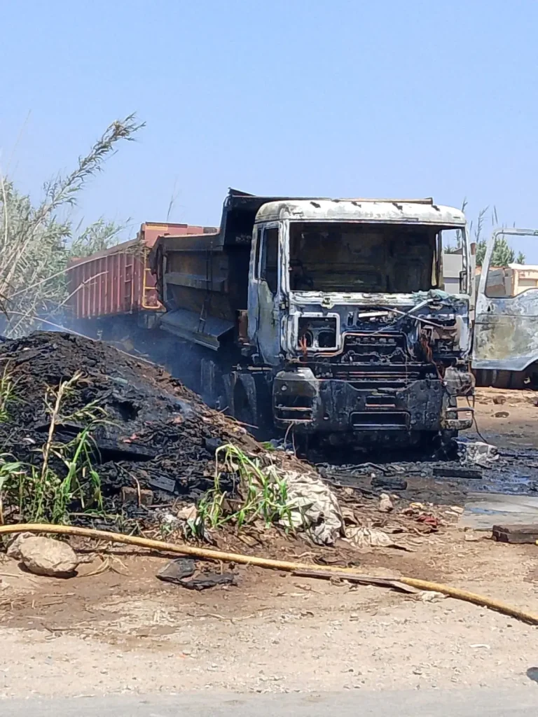 A fire devouring a truck completely on the road from Al -Madouz to Tamara