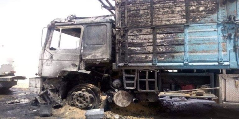 A fire devouring a truck in a street in Sidi Suleiman